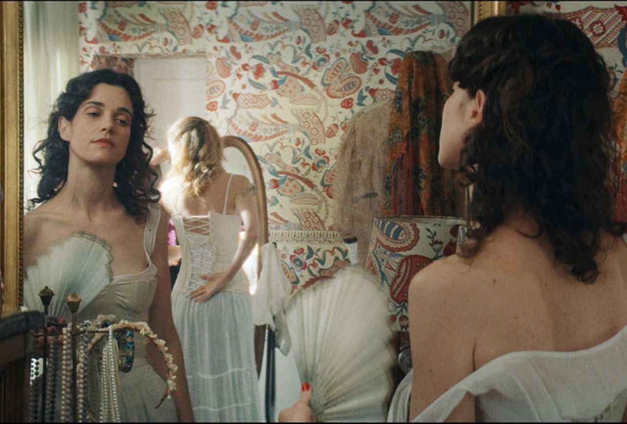 A scene involving Agathe choosing her outfit for a dance in the film Jane Austen Wrecked My Life. (Image via sonyclassics.com)